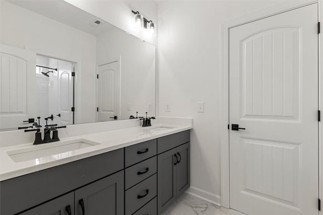 bathroom with vanity and walk in shower