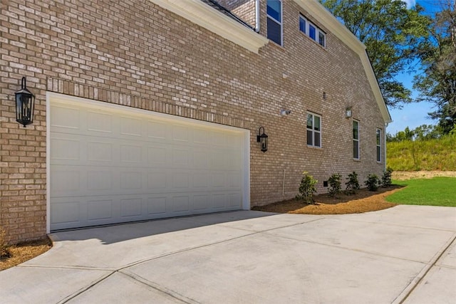 view of side of home featuring a garage