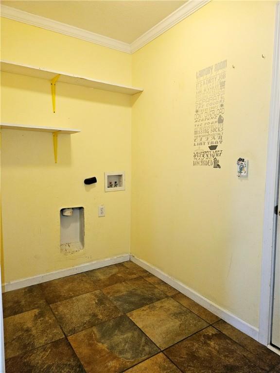 laundry room featuring crown molding and washer hookup