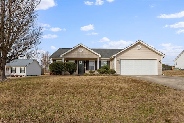 ranch-style house with a garage and a front lawn