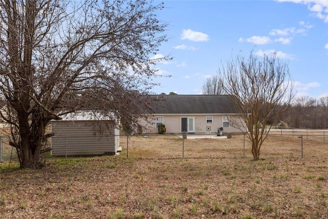 back of house featuring a yard