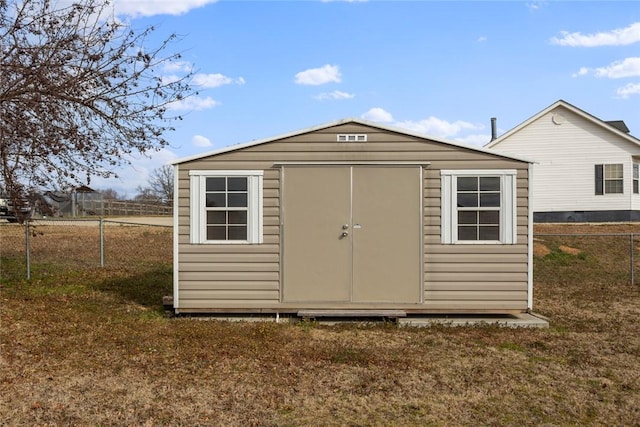 view of outbuilding featuring a lawn