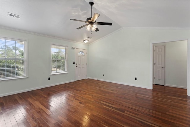 empty room with ceiling fan, ornamental molding, dark hardwood / wood-style floors, and vaulted ceiling