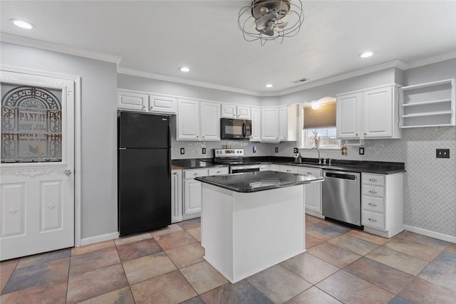 kitchen with sink, black appliances, a center island, ornamental molding, and white cabinets