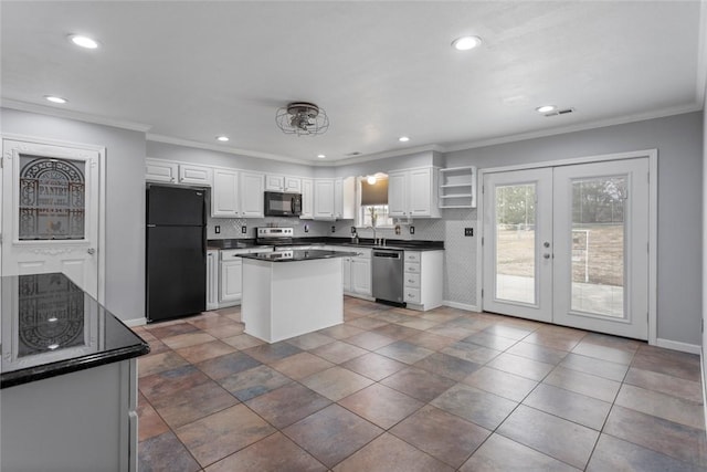 kitchen featuring french doors, ornamental molding, white cabinets, and black appliances