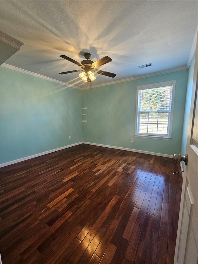 spare room with ornamental molding, dark wood-type flooring, ceiling fan, and a textured ceiling