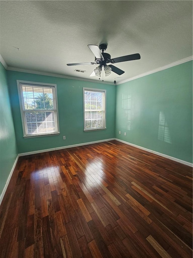 unfurnished room with crown molding, dark hardwood / wood-style floors, ceiling fan, and a textured ceiling