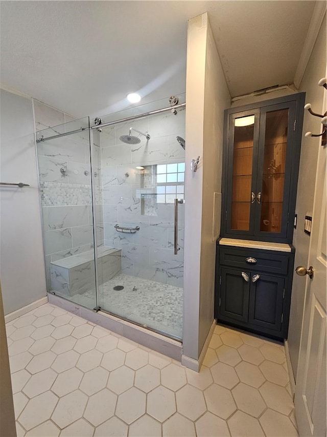 bathroom with a shower with door