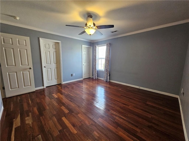 unfurnished bedroom with dark wood-type flooring, ornamental molding, and ceiling fan