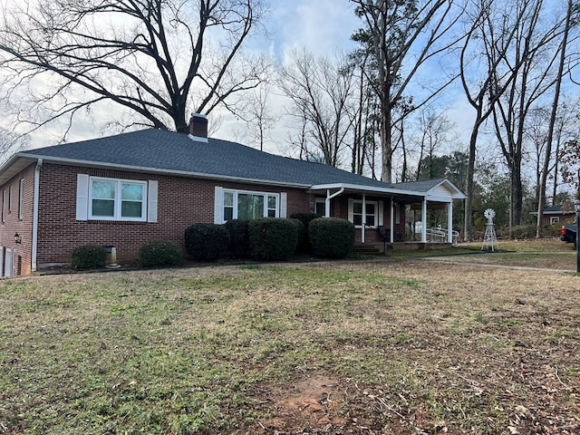 ranch-style house with a front yard and a porch