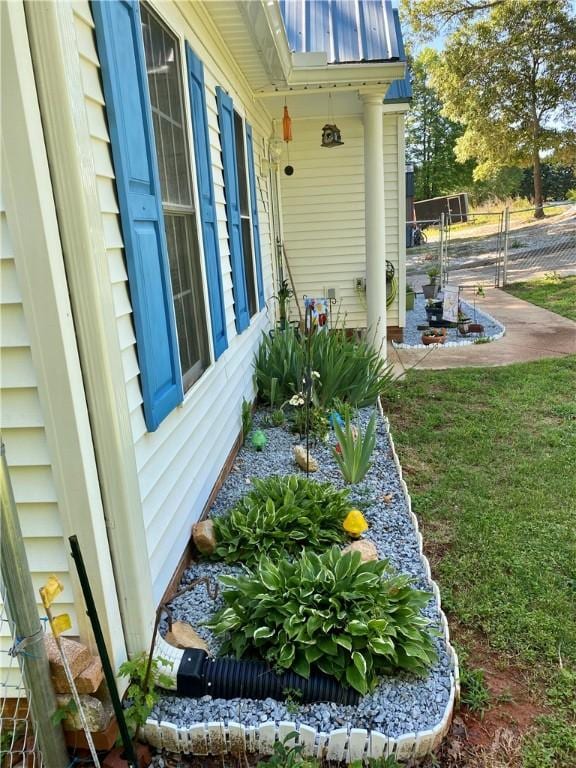 view of home's exterior with a yard