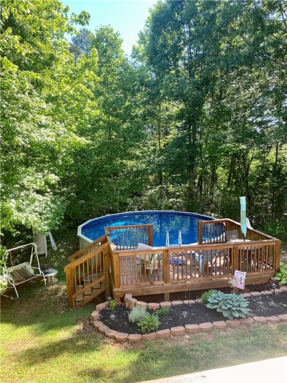 view of pool featuring a wooden deck