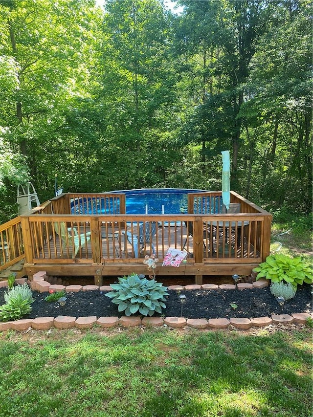 view of pool featuring a wooden deck