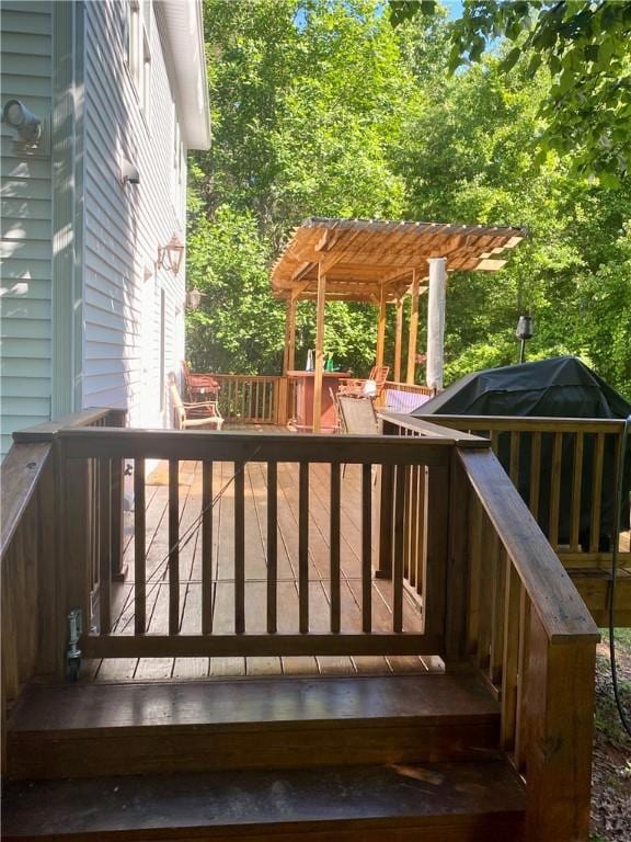 wooden terrace featuring a pergola