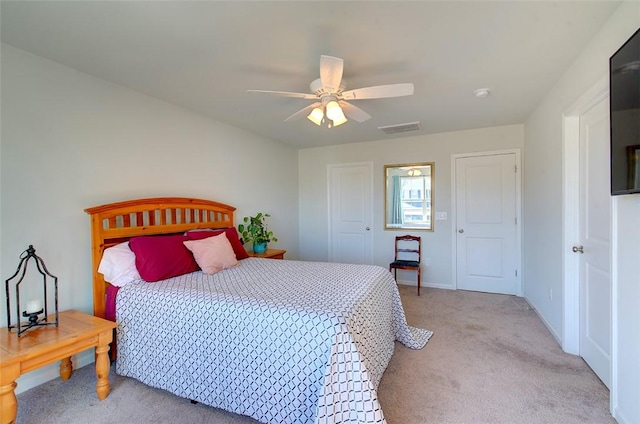 bedroom with light colored carpet and ceiling fan