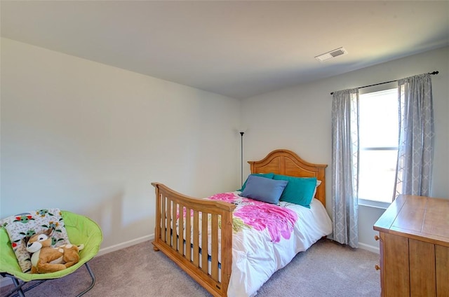 bedroom with light carpet