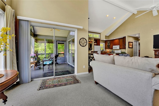 carpeted living room with ceiling fan, high vaulted ceiling, and beam ceiling