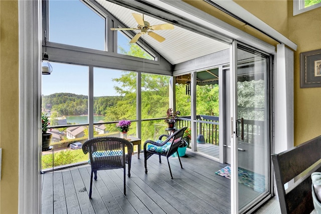 sunroom / solarium with ceiling fan and lofted ceiling