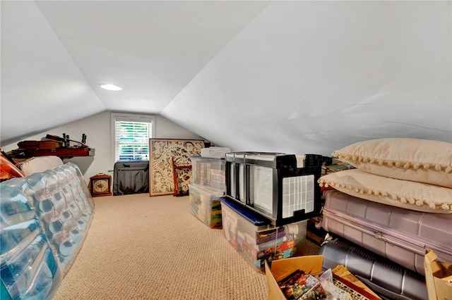 bedroom with lofted ceiling and carpet