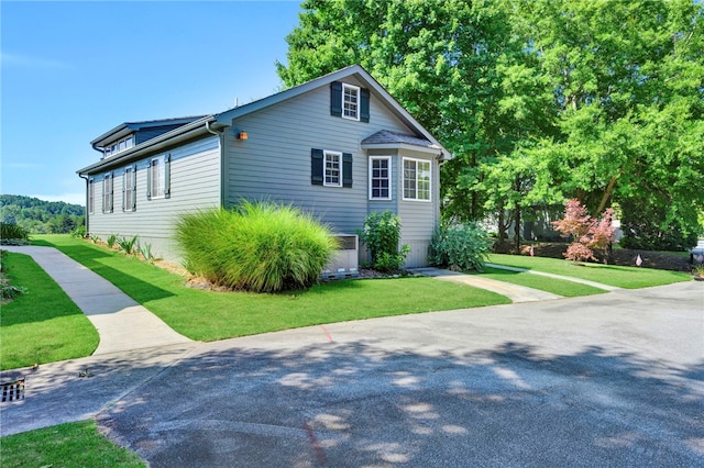 view of home's exterior featuring a yard