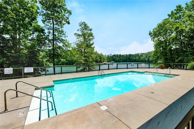 view of swimming pool featuring a patio area