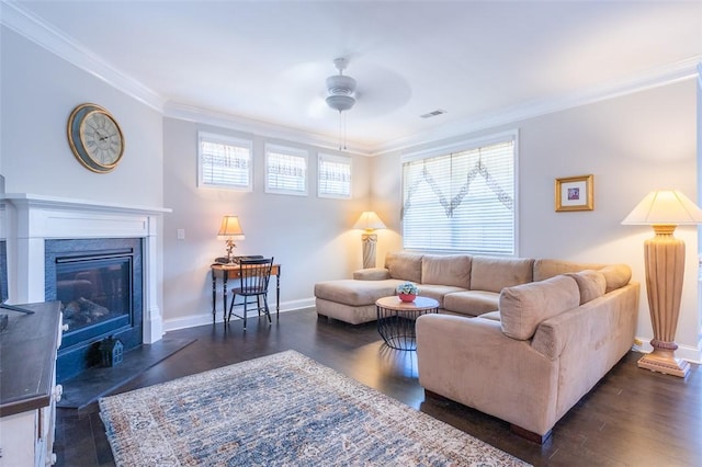 living room with crown molding, ceiling fan, and dark hardwood / wood-style floors