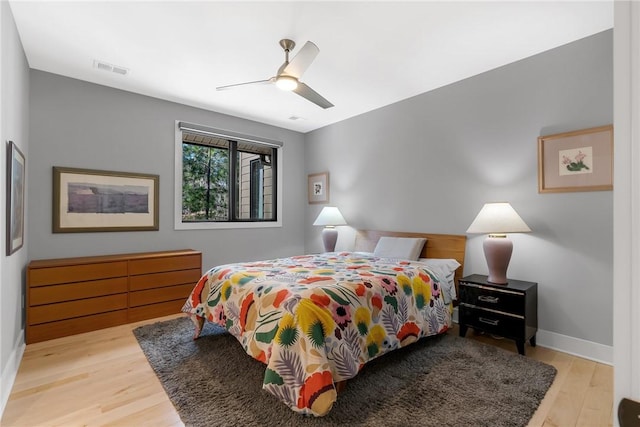 bedroom featuring light hardwood / wood-style flooring and ceiling fan