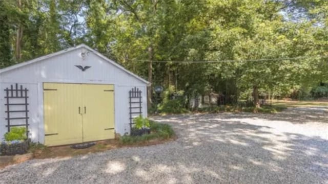 view of outdoor structure with a garage