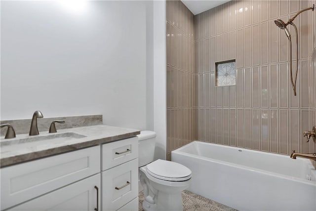 full bathroom featuring vanity, toilet, and tiled shower / bath