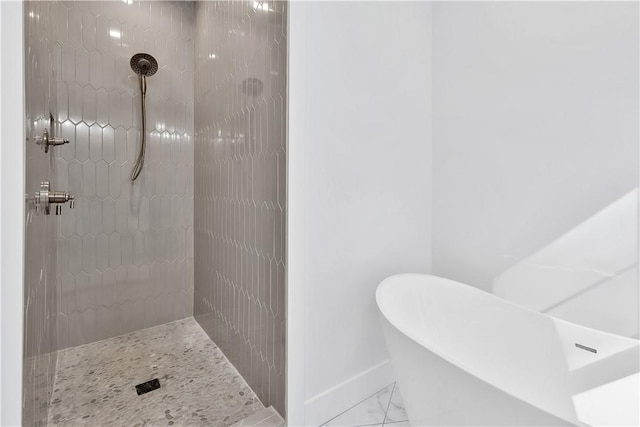 bathroom featuring separate shower and tub