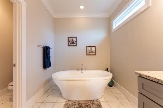 bathroom with crown molding, vanity, a bathtub, and toilet