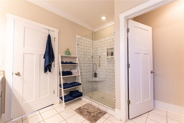 bathroom featuring ornamental molding and a shower with shower door