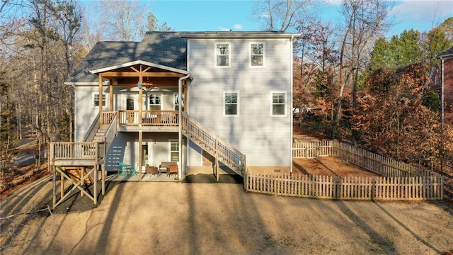 rear view of property with a patio area, ceiling fan, and a deck