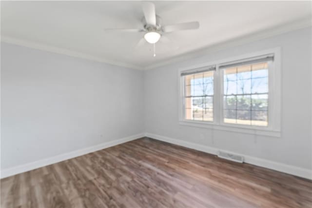 unfurnished room with hardwood / wood-style flooring, ceiling fan, and ornamental molding