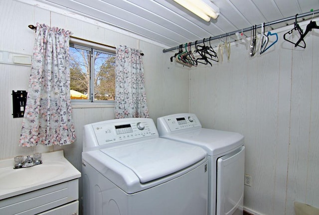 laundry area featuring independent washer and dryer and sink