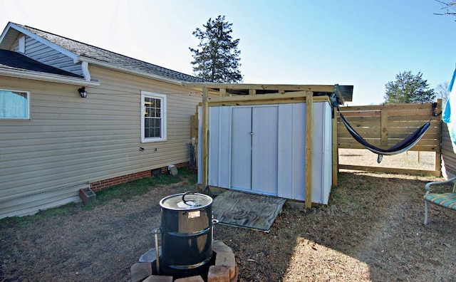 exterior space featuring a shed