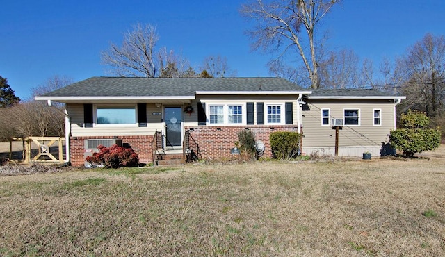 view of front of house featuring central AC unit and a front lawn