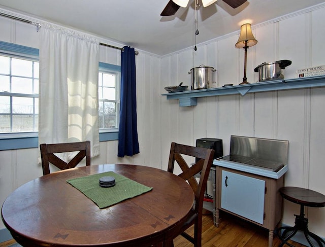 dining space featuring hardwood / wood-style flooring and ceiling fan