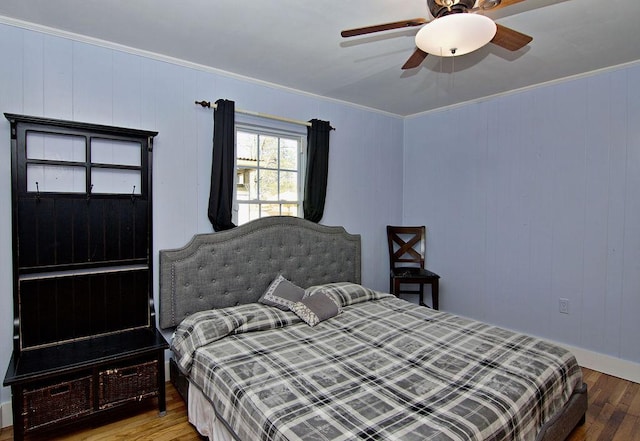 bedroom featuring ornamental molding, ceiling fan, and light hardwood / wood-style flooring