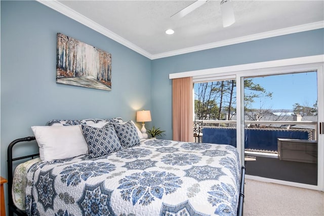 carpeted bedroom featuring crown molding and ceiling fan