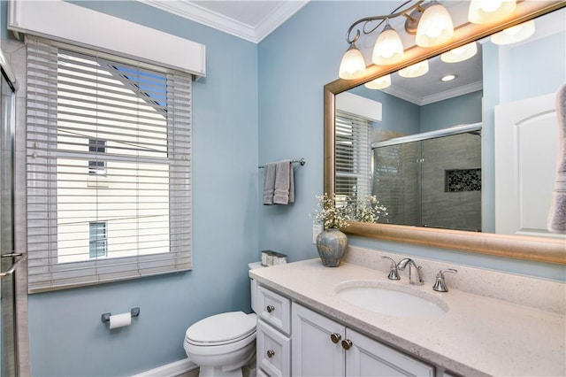 bathroom featuring crown molding, toilet, vanity, and walk in shower