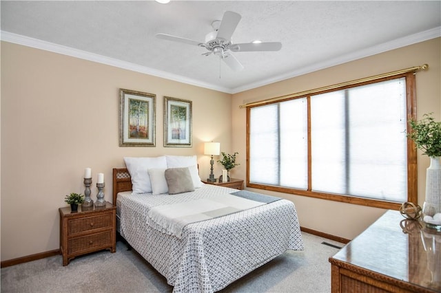 bedroom with crown molding, light colored carpet, and ceiling fan