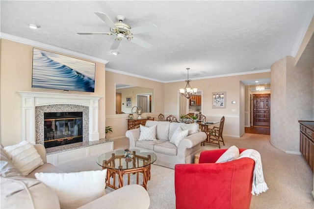 living room featuring crown molding, light colored carpet, a fireplace, and a textured ceiling