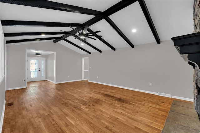 unfurnished living room with vaulted ceiling with beams, ceiling fan, and light hardwood / wood-style flooring