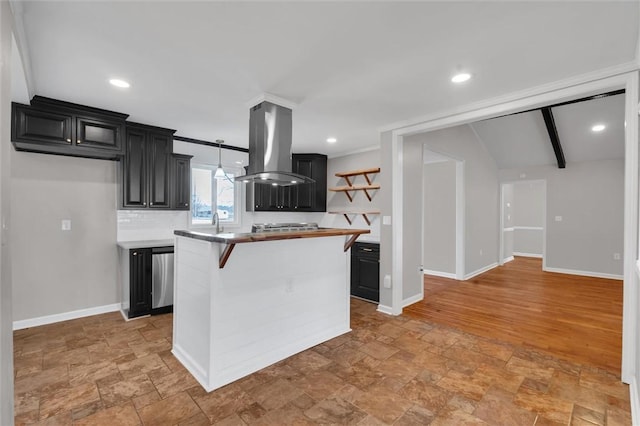 kitchen with a breakfast bar, backsplash, island range hood, a kitchen island, and vaulted ceiling