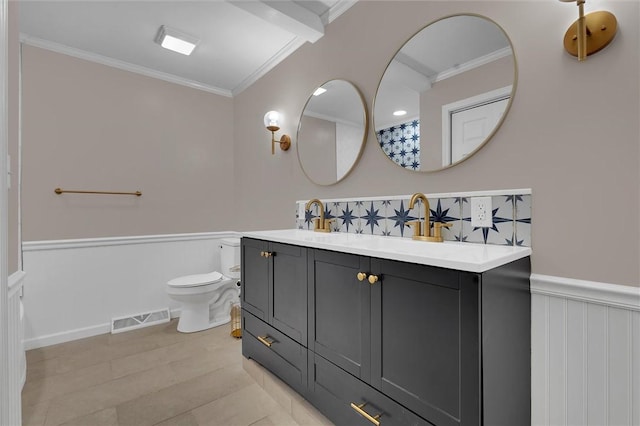 bathroom featuring ornamental molding, toilet, and vanity