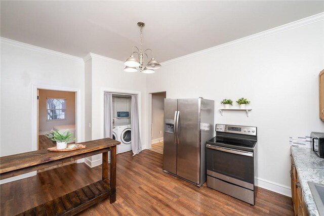 kitchen featuring dark hardwood / wood-style flooring, washer / dryer, pendant lighting, and appliances with stainless steel finishes