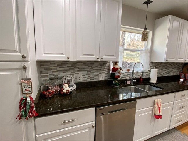 kitchen featuring sink, white cabinets, and dishwasher