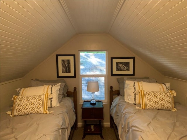 bedroom with lofted ceiling, carpet floors, and wood ceiling