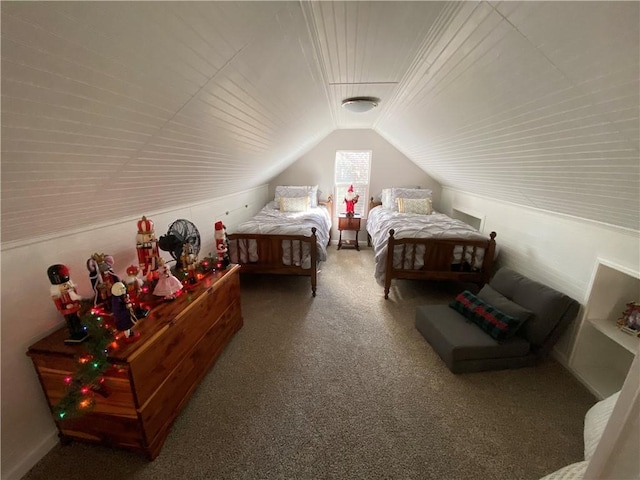 bedroom with vaulted ceiling and carpet